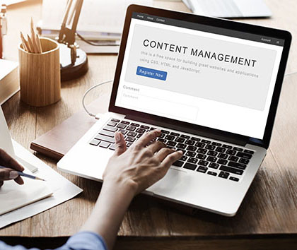 Image of a laptop with content management software on the screen